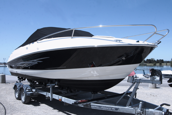 Boat on a trailer preparing for winterizing services.